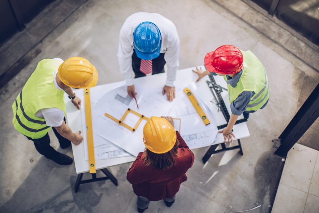 construction workers around table